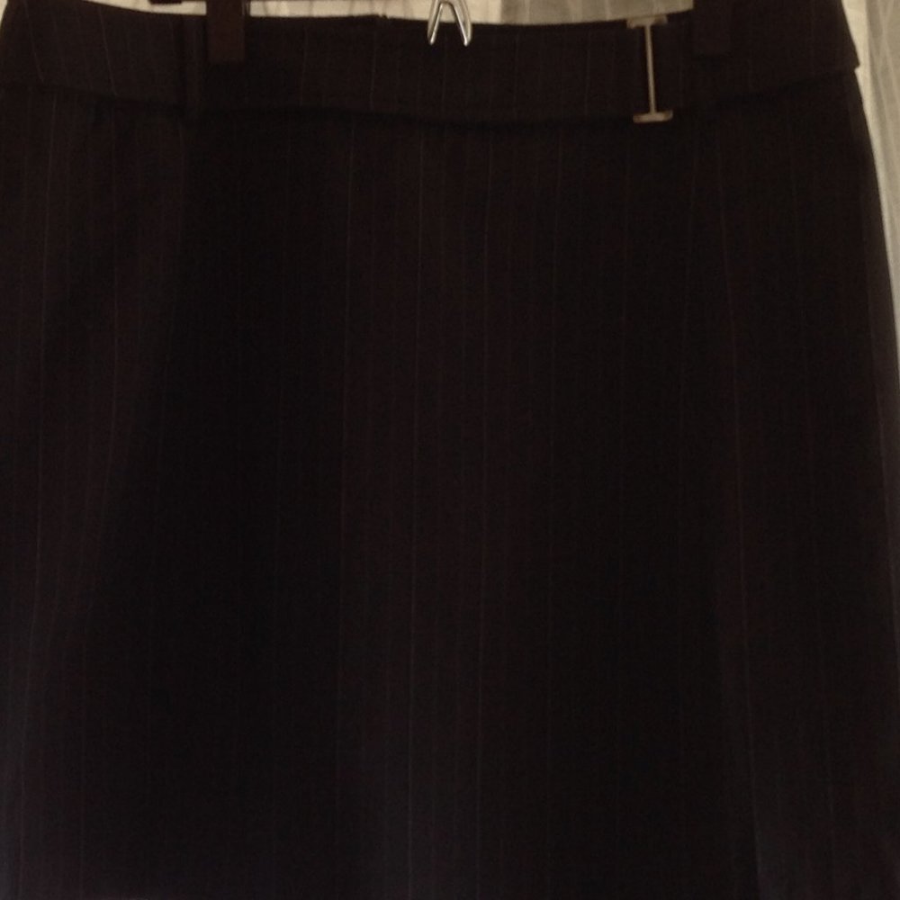 Dressy black above-knee skirt with thin white pinstripes. Sz 12 by NYC